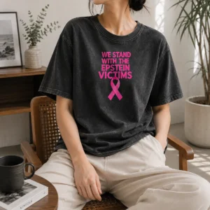Hot Original We Stand With The Epstein Victims Pink Ribbon Washed T Shirt in soft pink with clear ribbon graphic