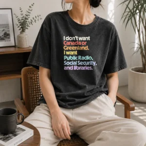 Pretty I Don'T Want Canada Or Greenland I Want Public Radio Social Security And Libraries printed on a soft washed t shirt in light gray